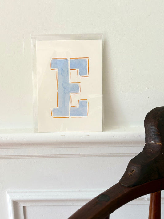 "E" Orange & Blue Watercolor on Cotton Paper by Painted by Marissa