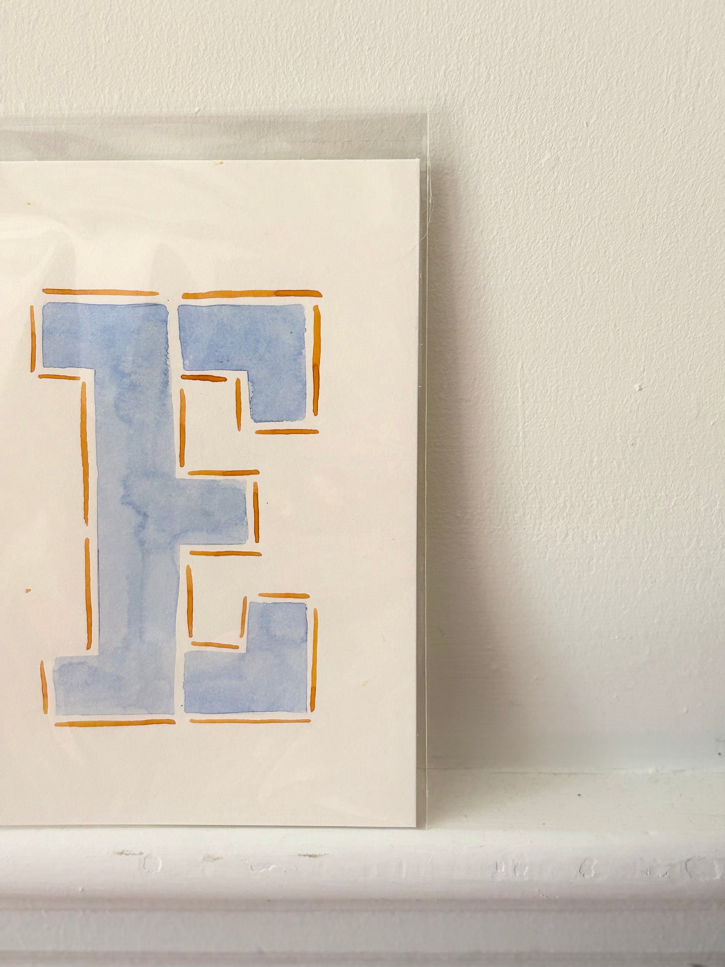 "E" Orange & Blue Watercolor on Cotton Paper by Painted by Marissa